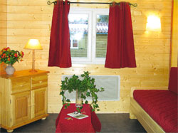 équipements et espace de détente cosy dans chalets en boisl